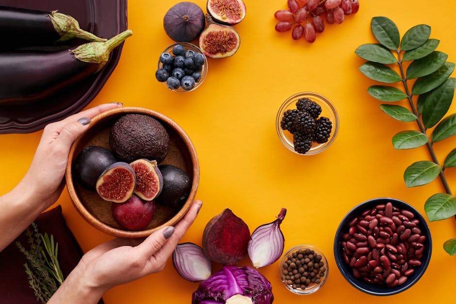 Vibrant array of fresh fruits and vegetables arranged in beautiful harvest display